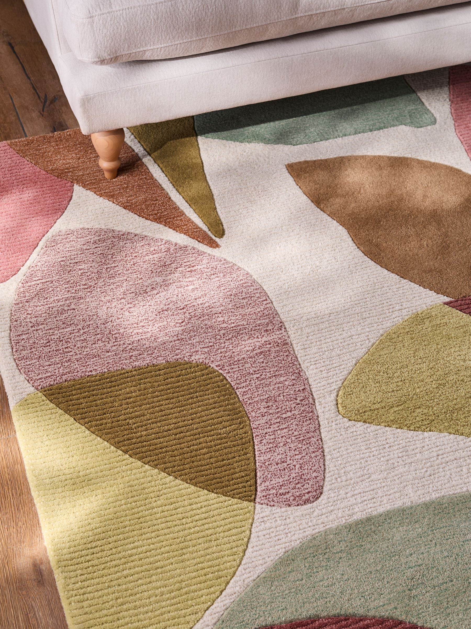 Multi abstract leaf wool rug with tufted textured finish (British brand)