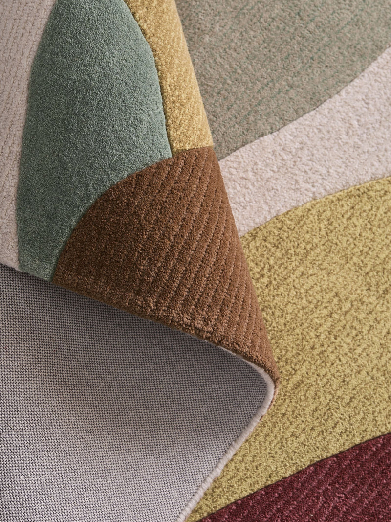 Multi abstract leaf wool rug with tufted textured finish (British brand)