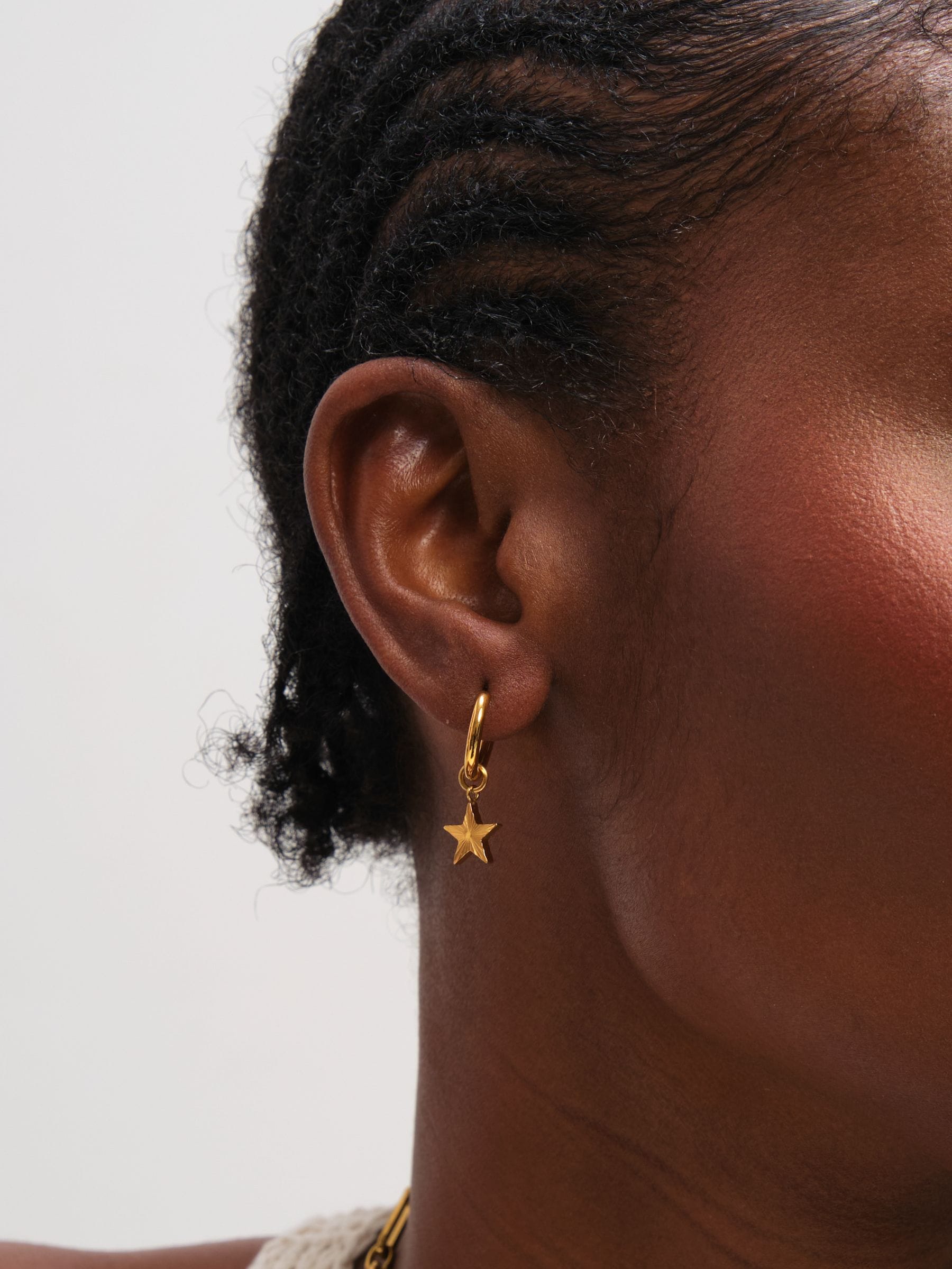 Jon Richard gold tone huggie earrings with star design - British product