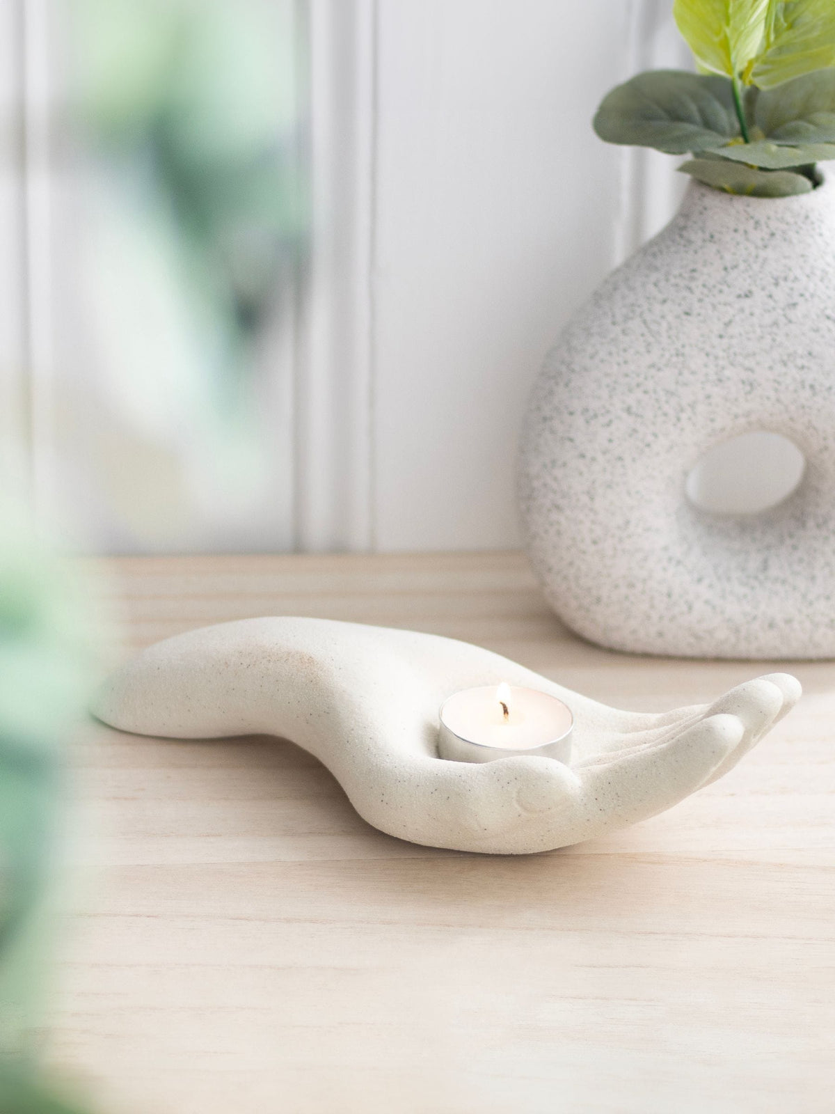 Something Different cream open hand tealight holder (British brand)