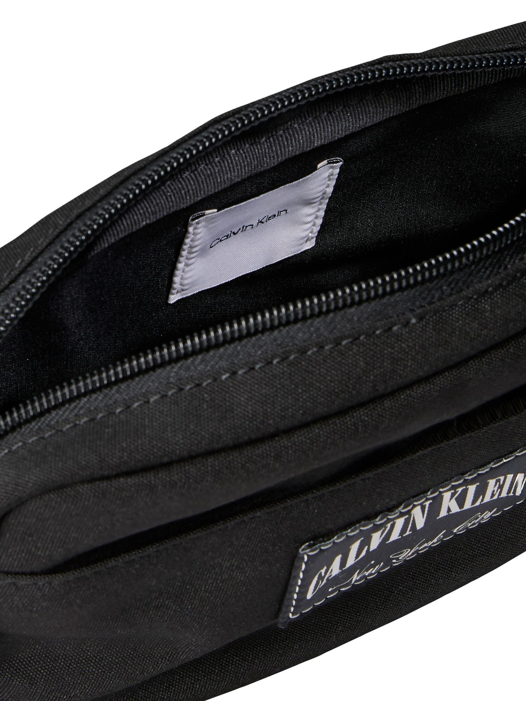 Calvin Klein black cross-body bag, imported from the UK