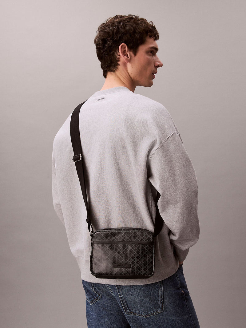 Calvin Klein black cross-body bag, imported from the UK
