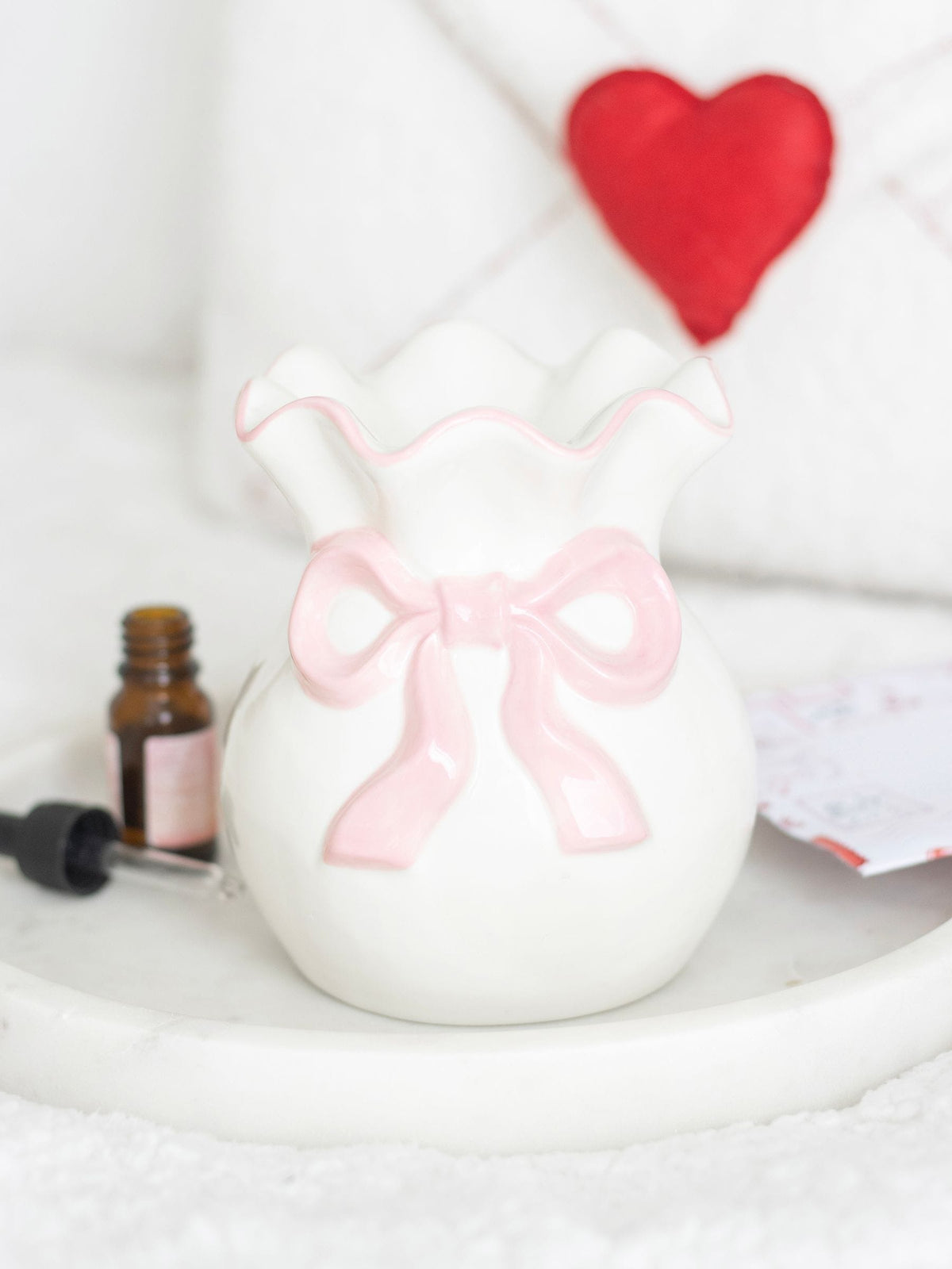 Something Different white and pink bow oil burner, UK version