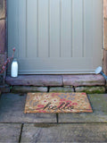 Artsy Mats Brown Hello Scribbly Floral doormat (British brand)