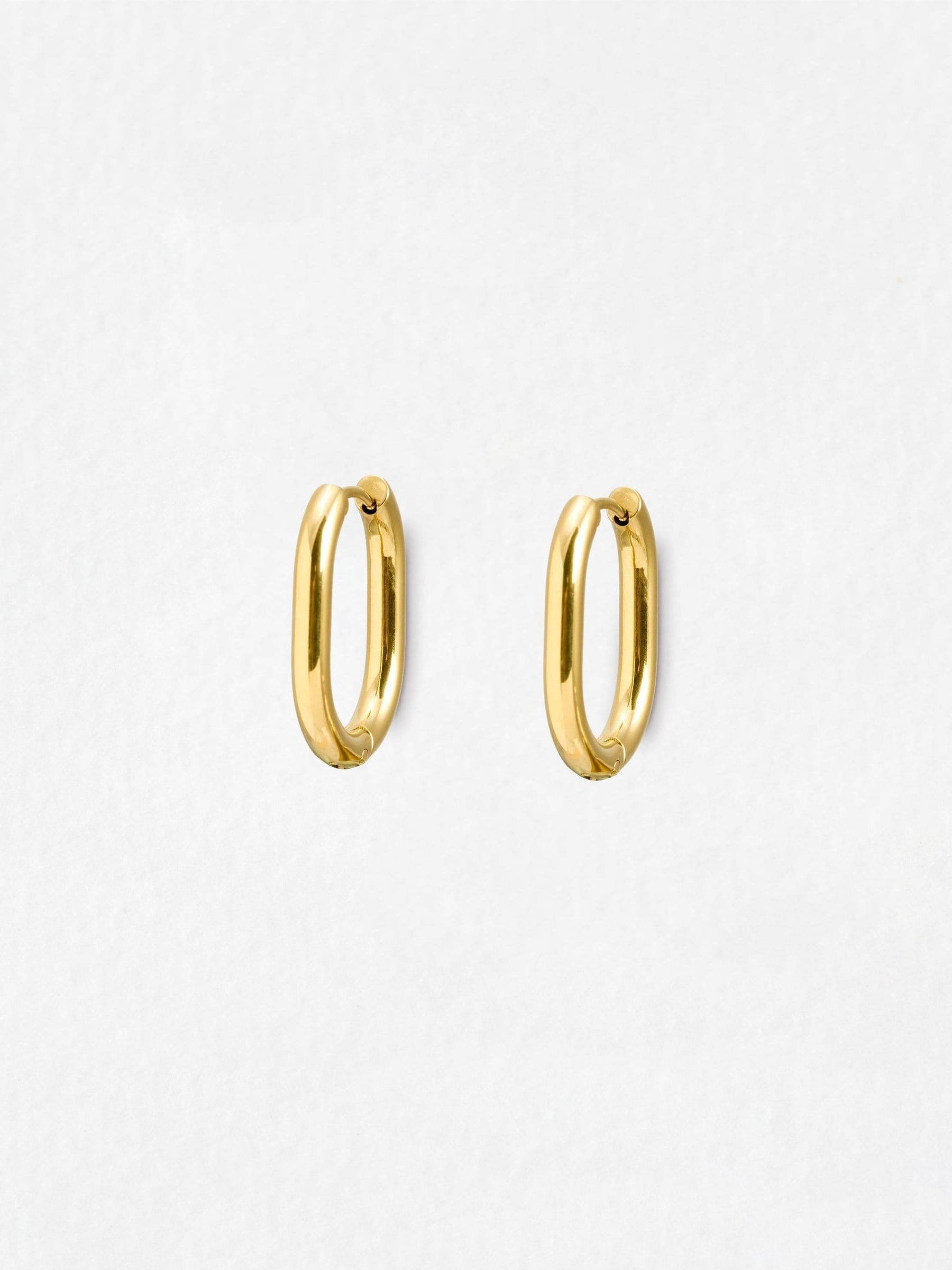 Oliver Bonas gold tone oval hoop earrings, imported from the UK