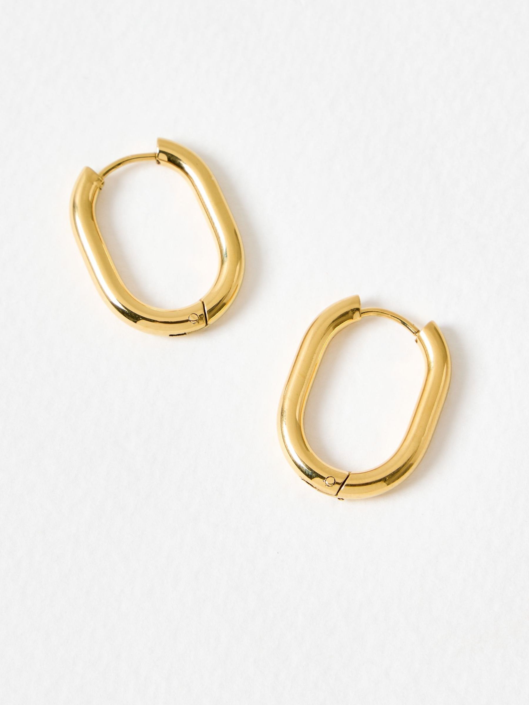 Oliver Bonas gold tone oval hoop earrings, imported from the UK