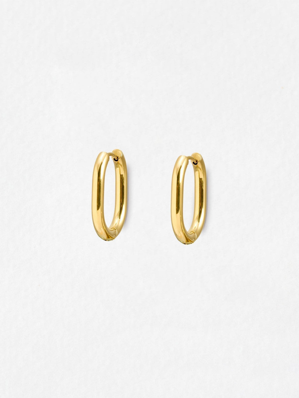 Oliver Bonas gold tone oval hoop earrings, imported from the UK