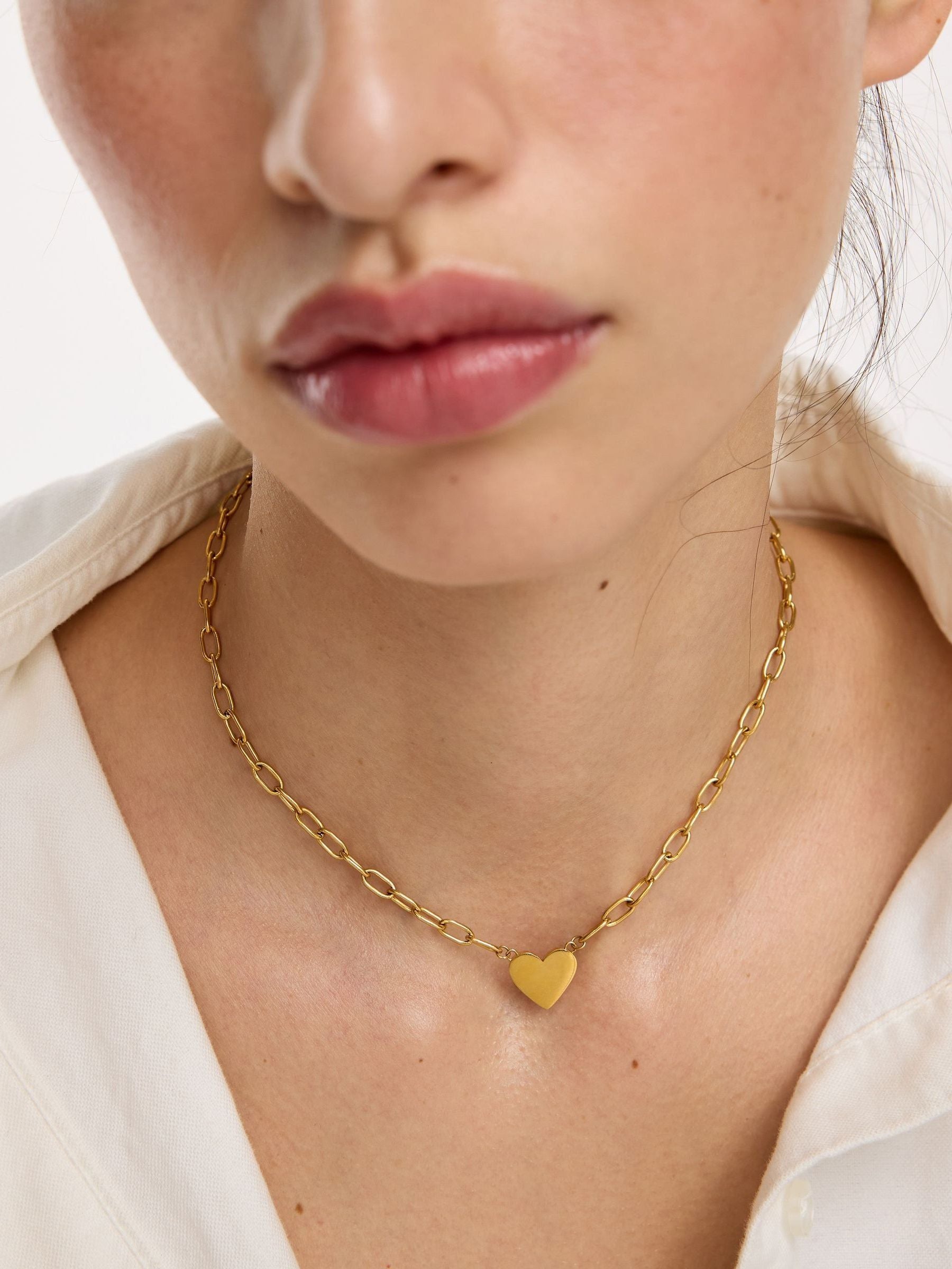 Oliver Bonas Talula gold-tone stainless steel heart pendant necklace, imported from the UK