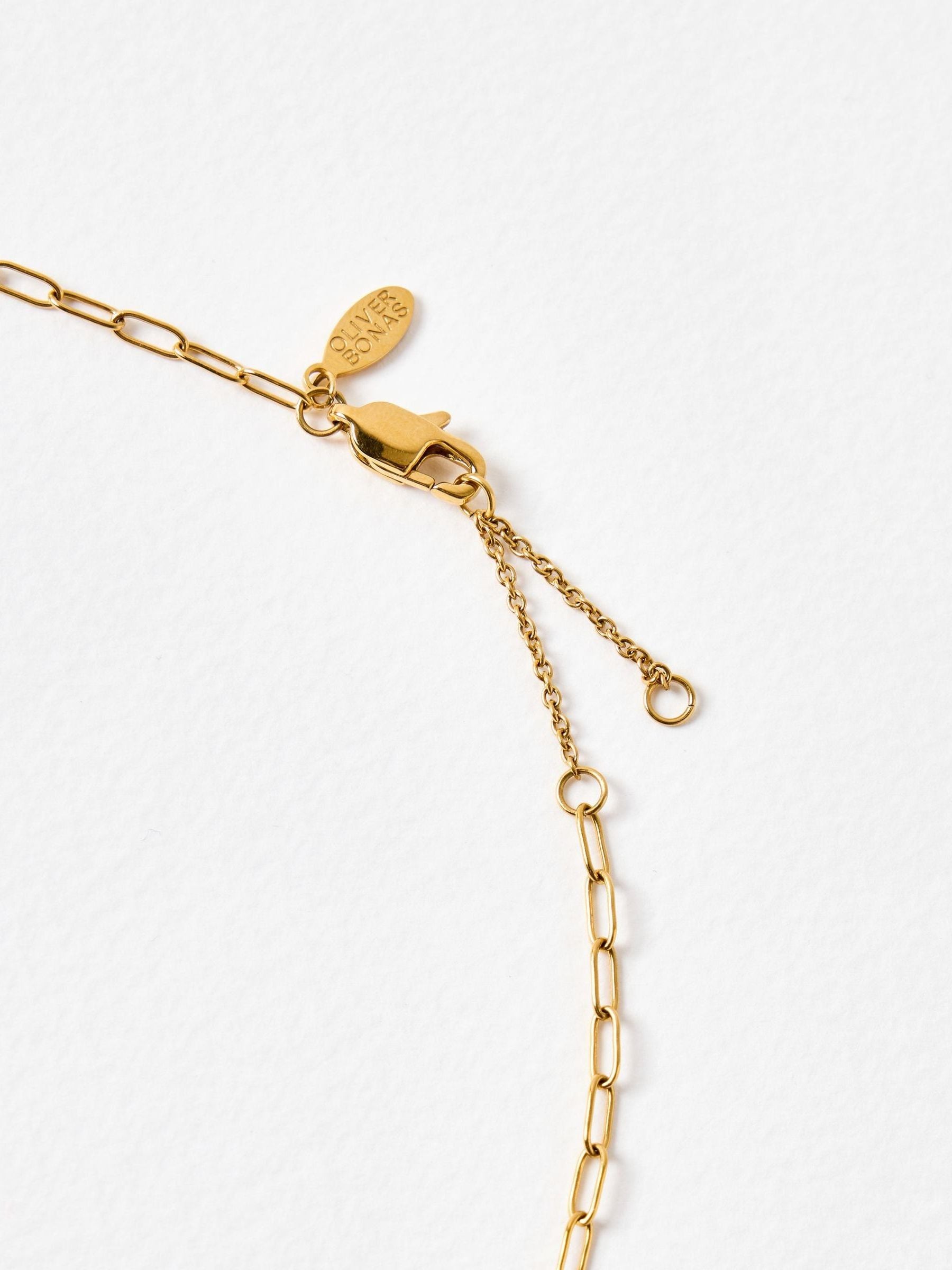 Oliver Bonas gold charm necklace, UK version