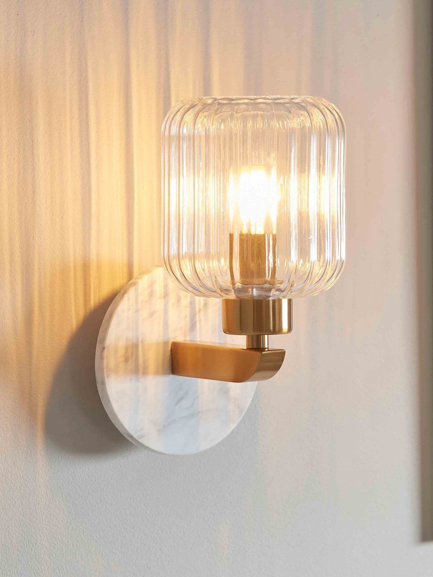 Gallery Home White Travine Ribbed Wall Light Marble