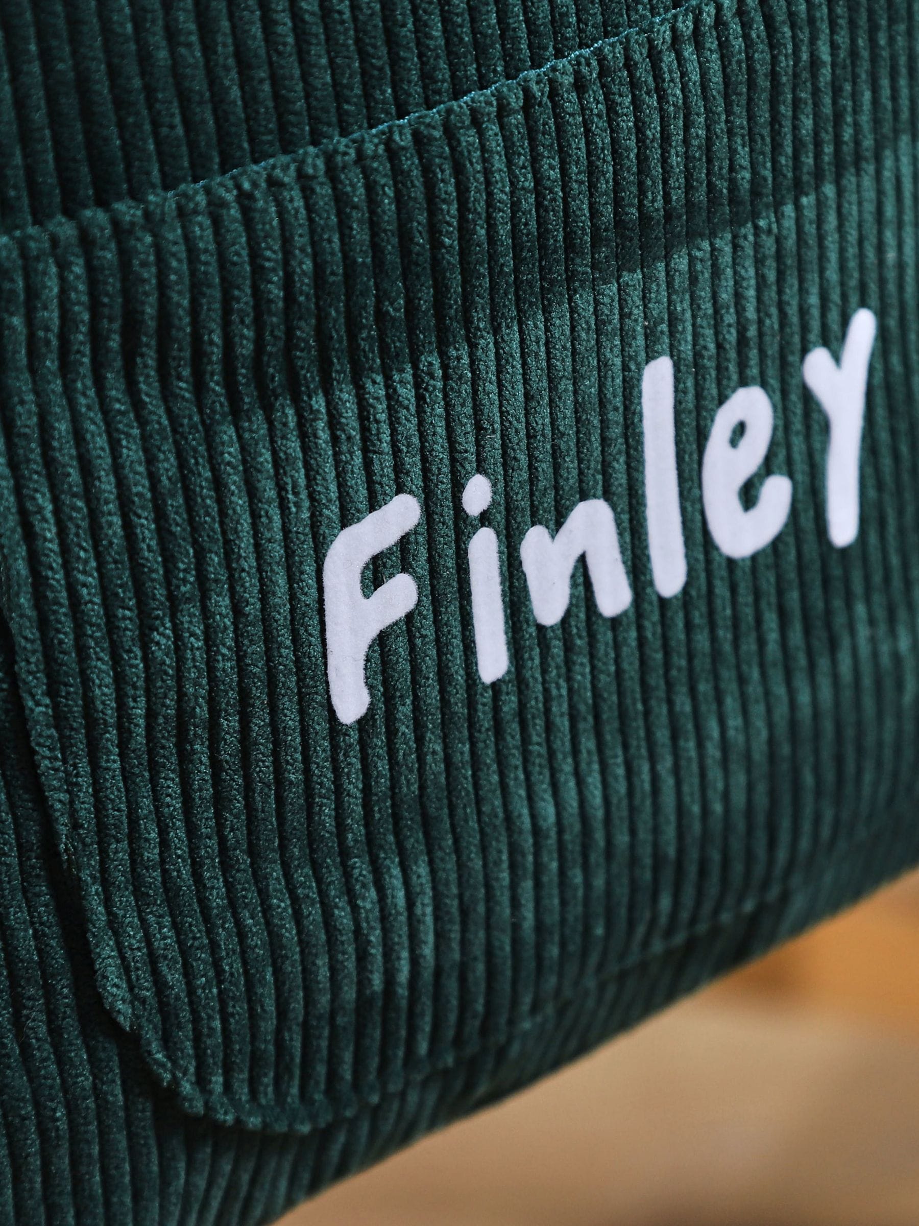 My 1st Years mini forest green cord backpack, imported from the UK