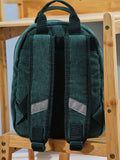 My 1st Years mini forest green cord backpack, imported from the UK