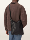 AllSaints Black Haven flat crossbody bag, imported from the UK
