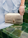 Novo gold clutch bag with twist hardware closure (British brand)
