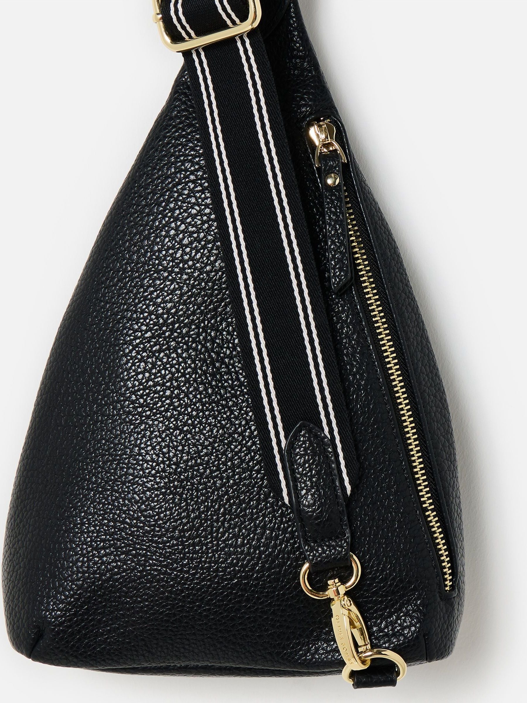 Oliver Bonas black belt bag with gold hardware, imported from the UK