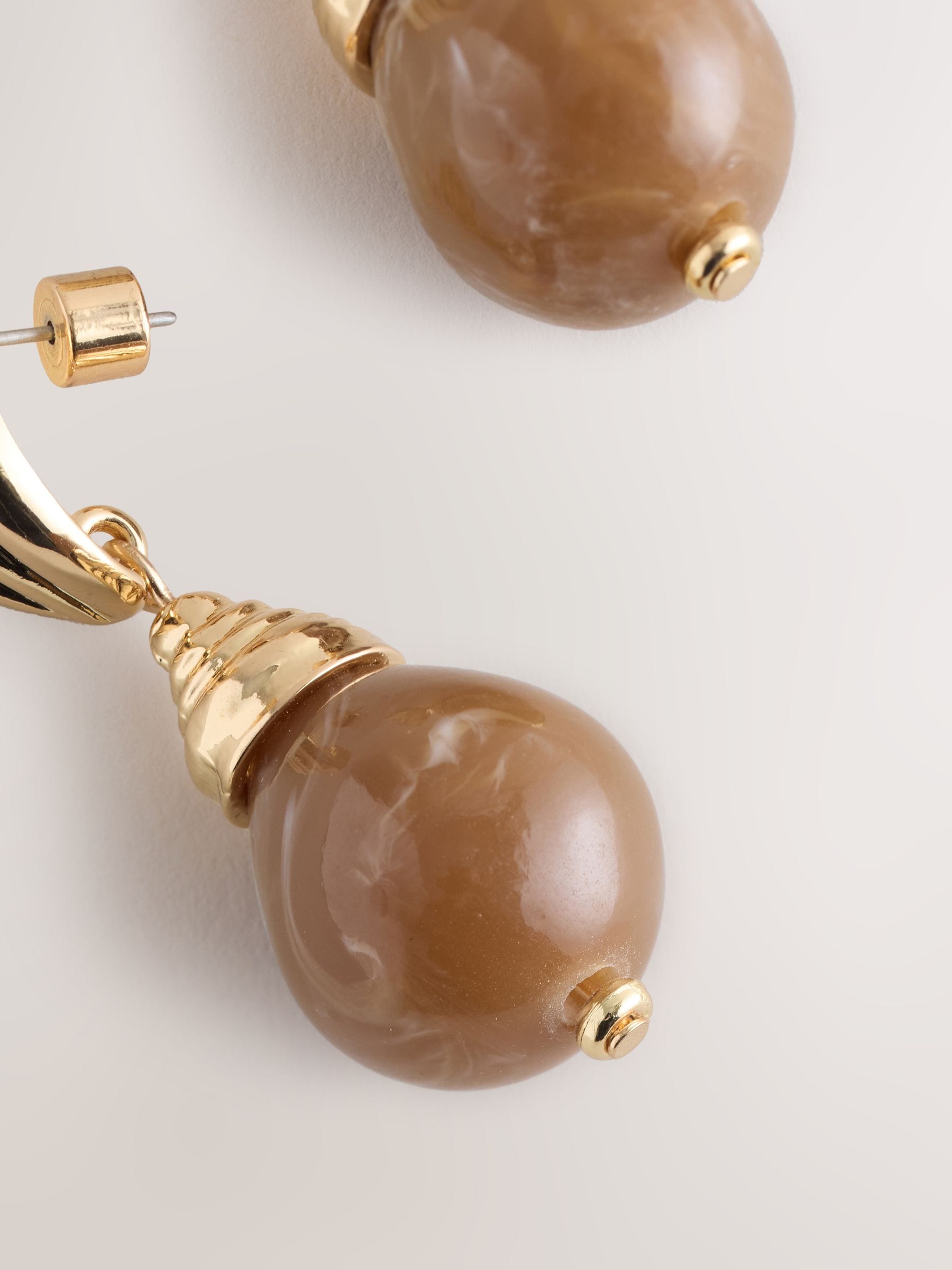 Brown resin drop earrings, UK version