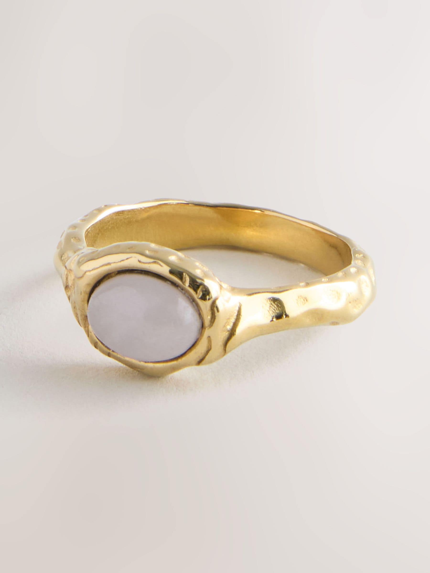 Gold tone hammered ring with pink semi precious stone - British product