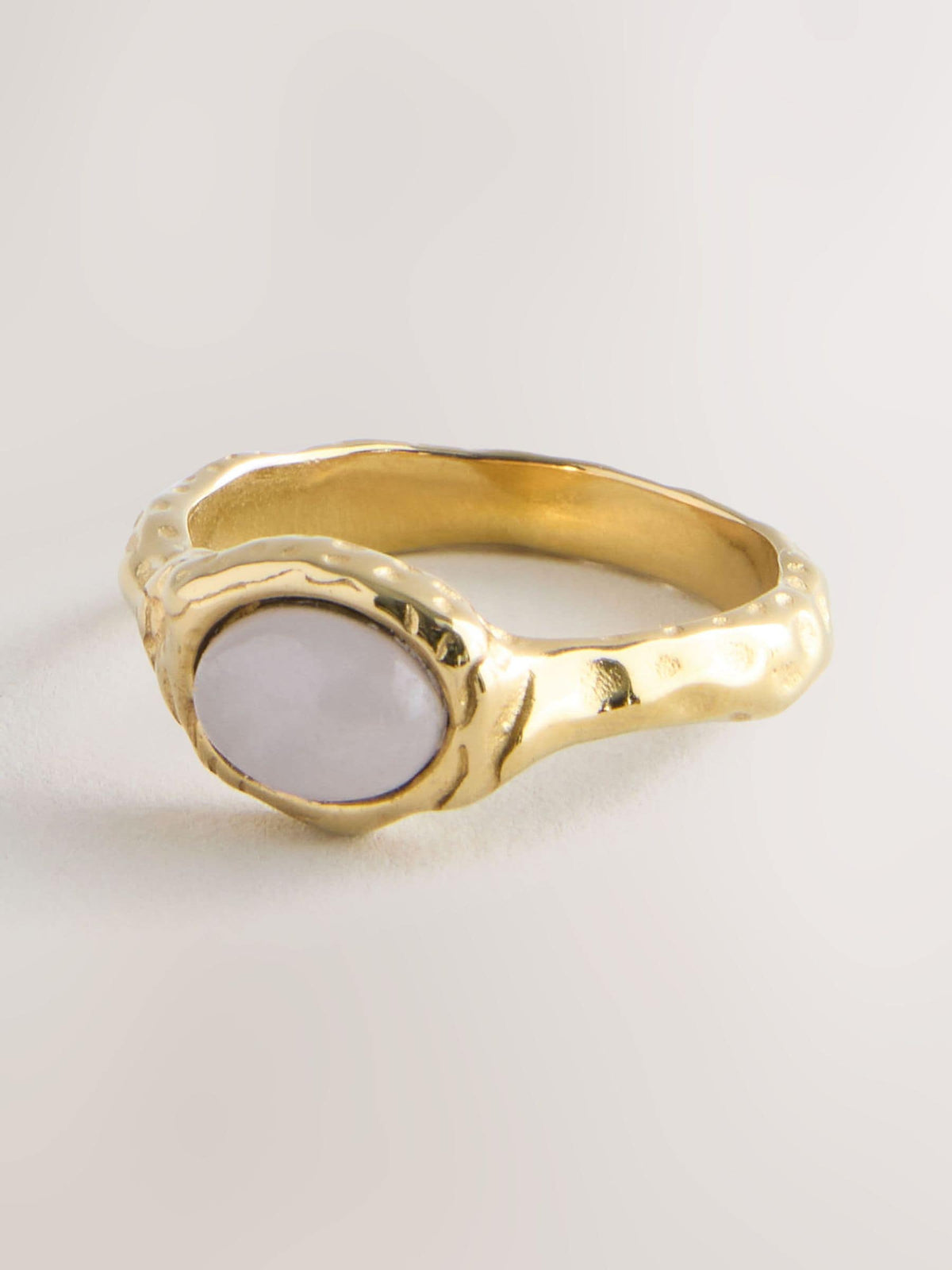 Gold tone hammered ring with pink semi precious stone - British product