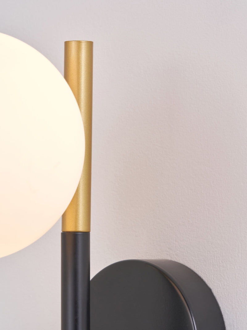 White Wanda orb metal wall light, imported from the UK