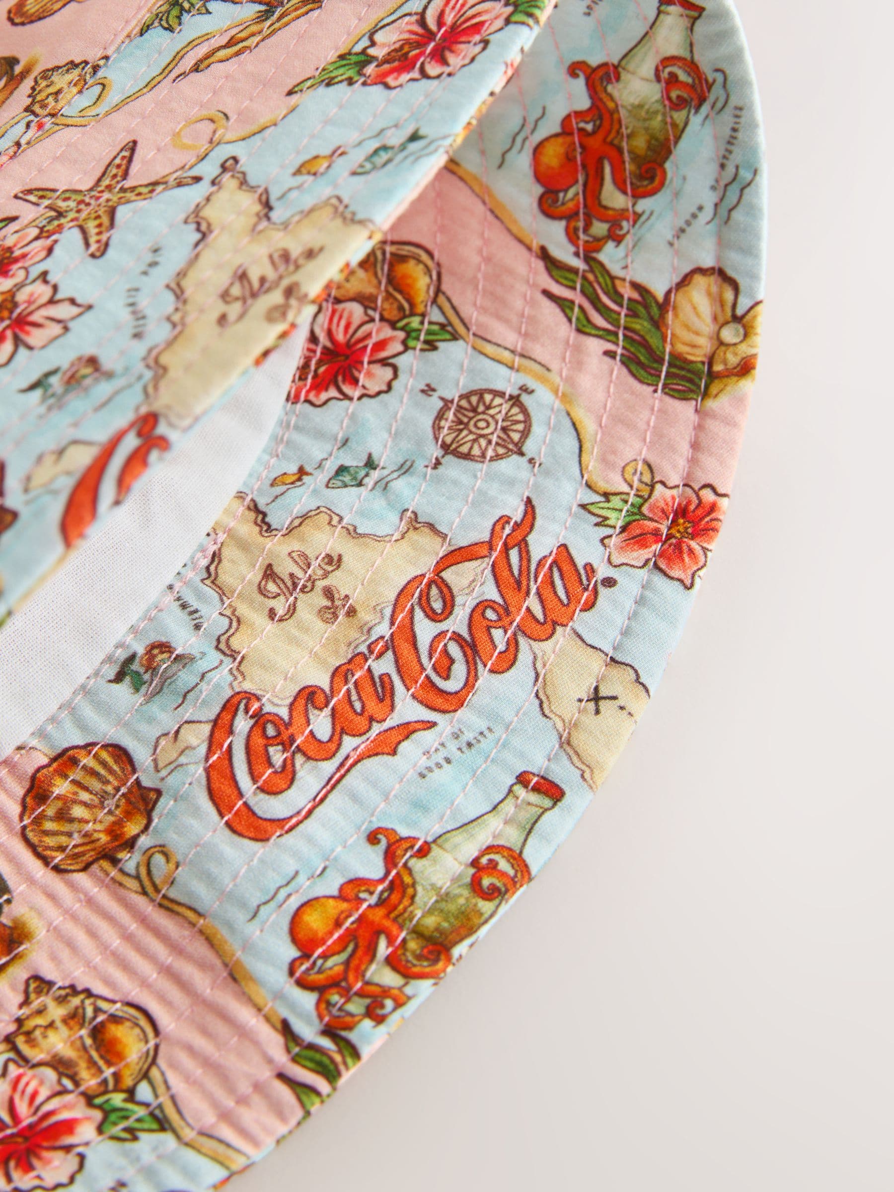 Coca Cola licensed map print bucket hat, imported from the UK