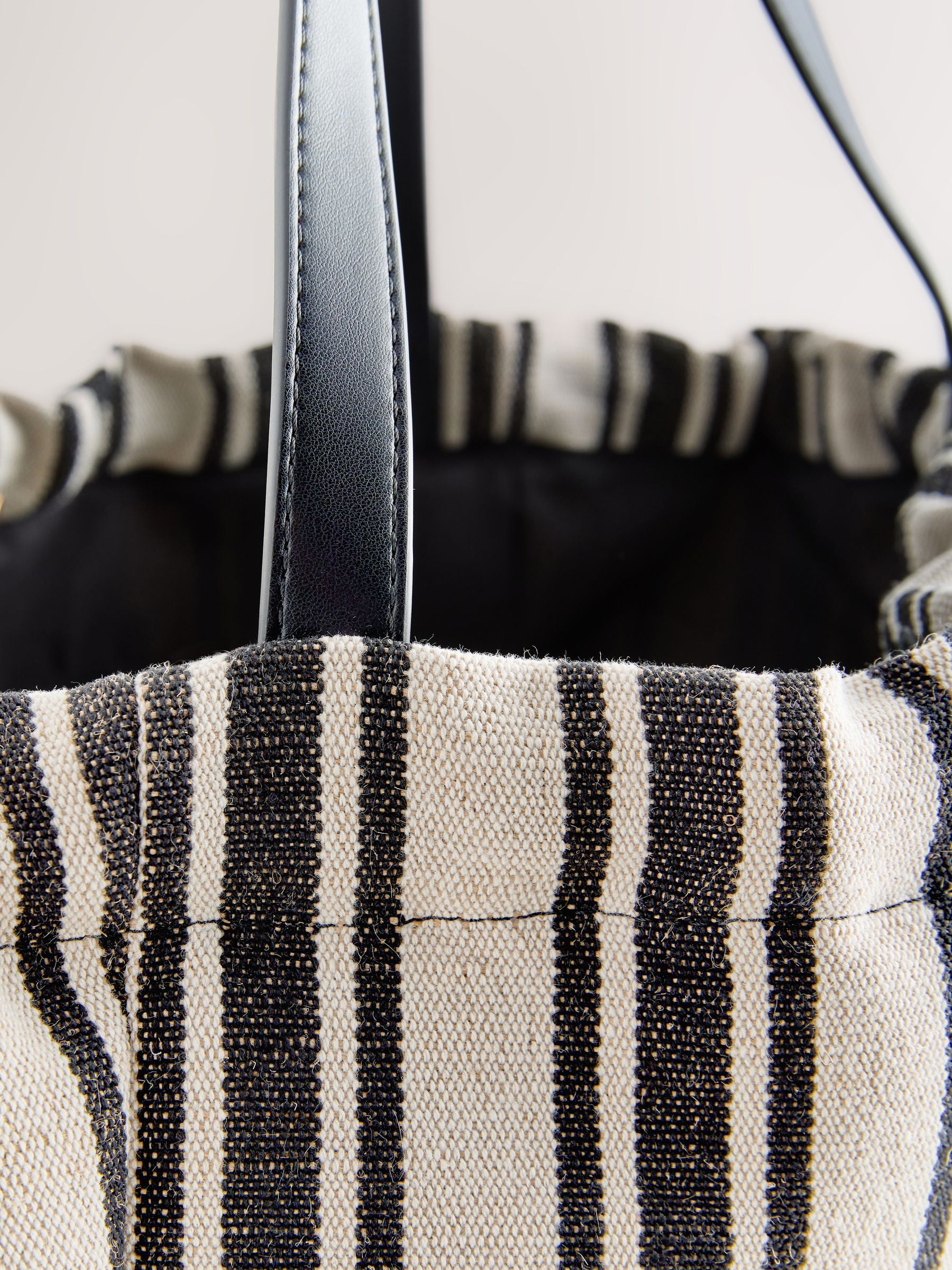 Black and white stripe drawstring shoulder bag, imported from the UK