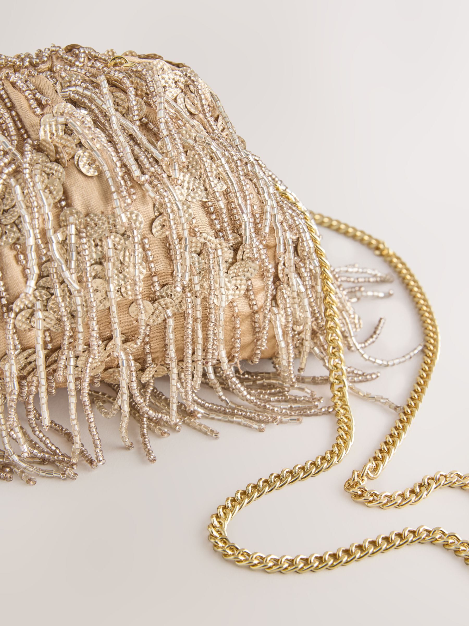 Champagne gold pearl effect fringe clutch bag, UK version