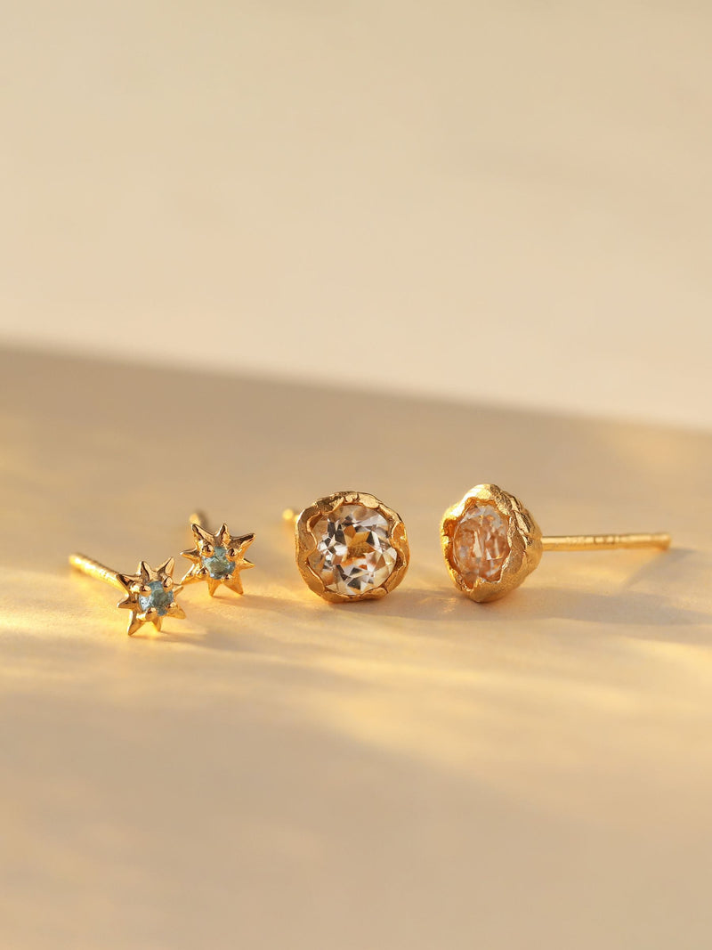 Carrie Elizabeth Gold Tone Dainty Blue Topaz Star Stud Earrings