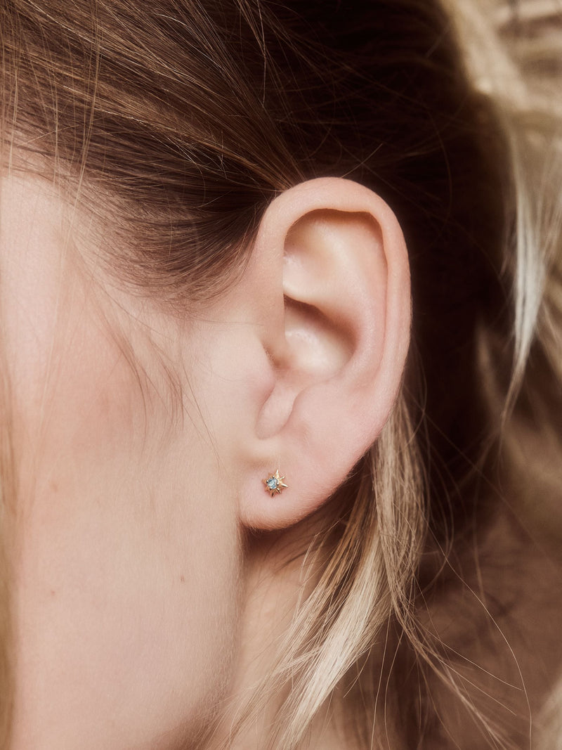 Carrie Elizabeth Gold Tone Dainty Blue Topaz Star Stud Earrings