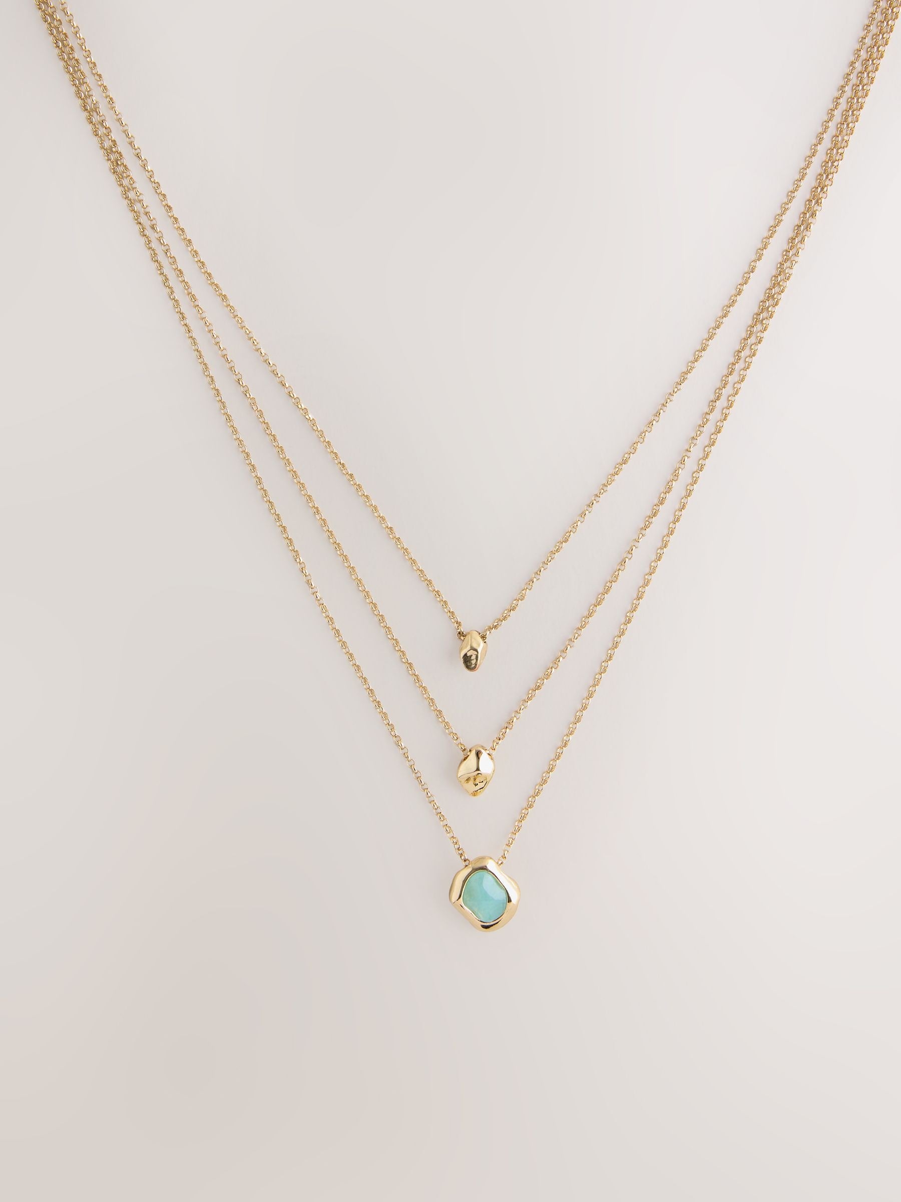 Gold tone layered stone necklace (British brand)