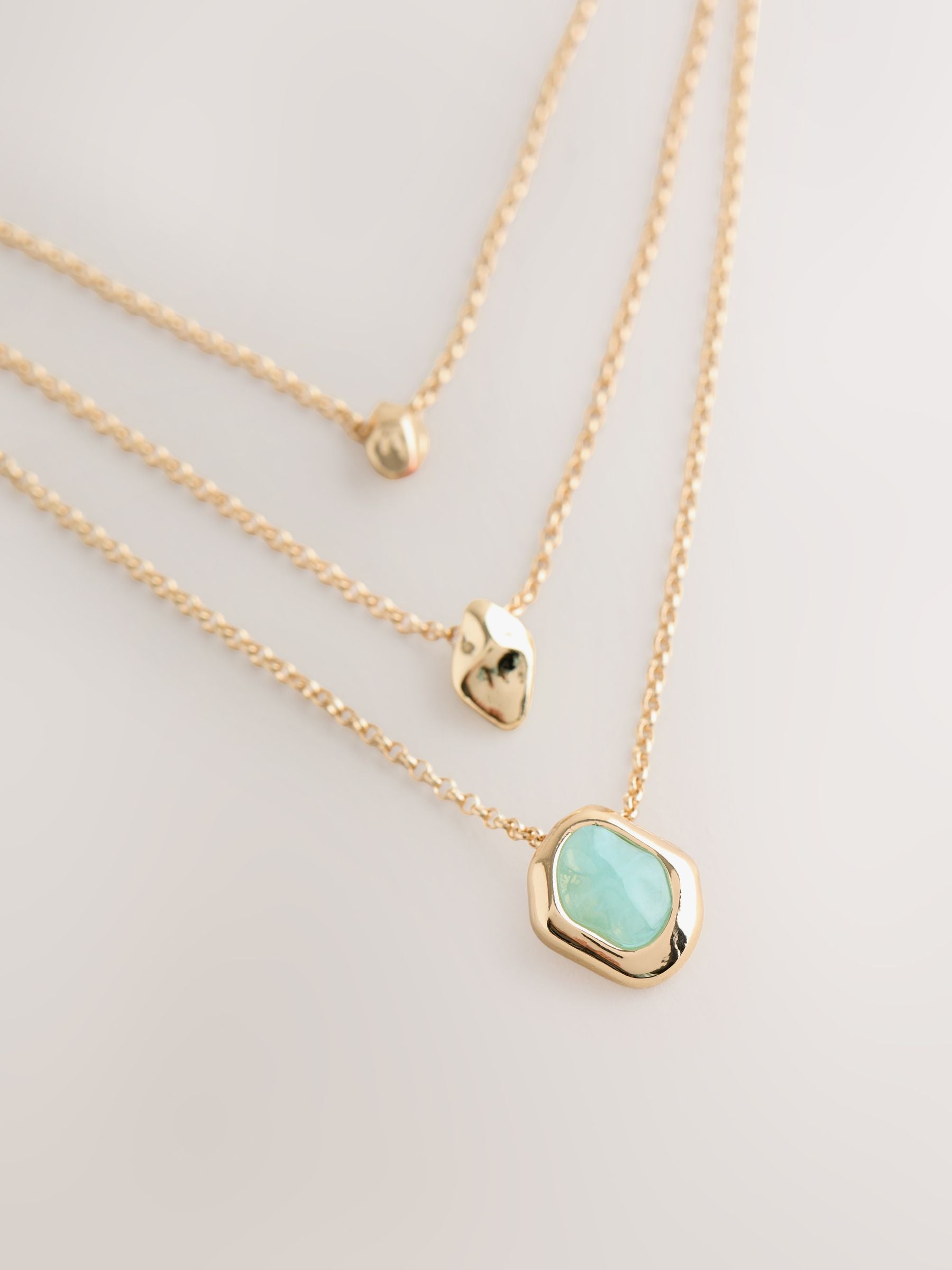 Gold tone layered stone necklace (British brand)