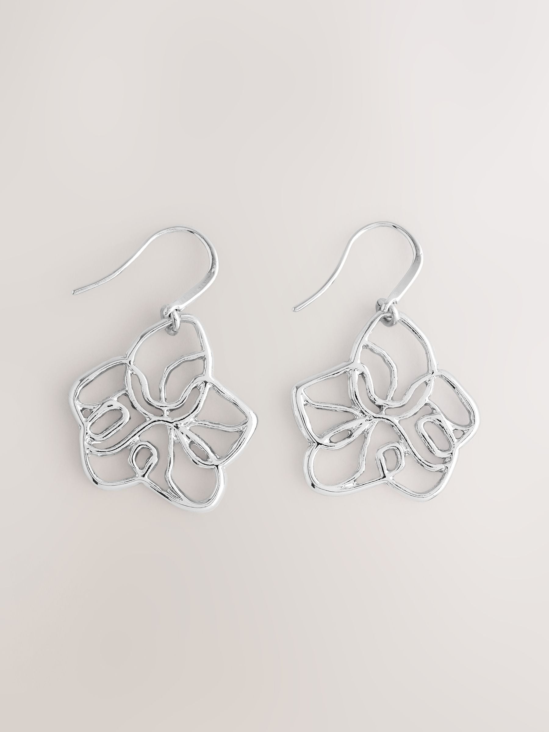Silver tone flower drop earrings with fish-hook fastening, UK version
