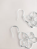 Silver tone flower drop earrings with fish-hook fastening, UK version