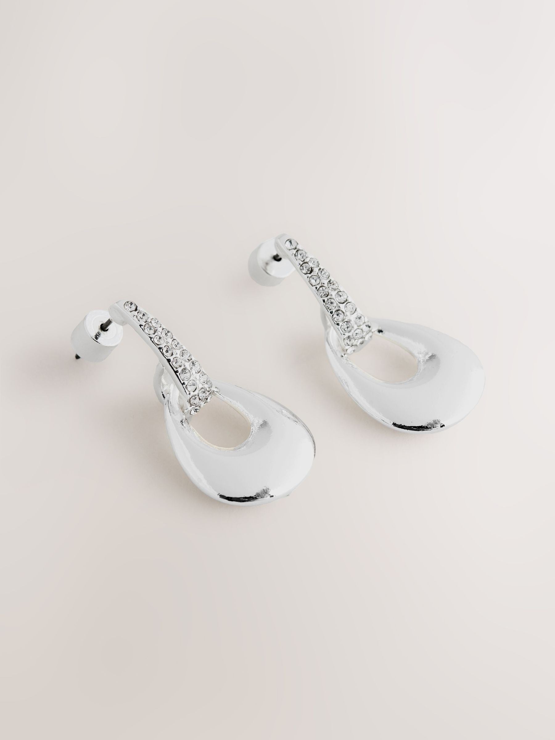Silver-tone drop pendant earrings with diamond detailing, UK version