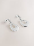 Silver-tone drop pendant earrings with diamond detailing, UK version