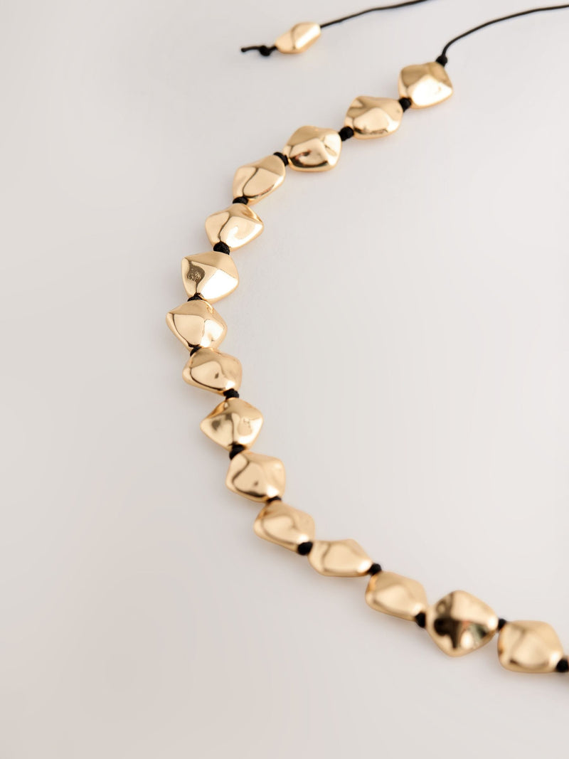 Gold tone chunky beaded cord adjustable necklace, UK version