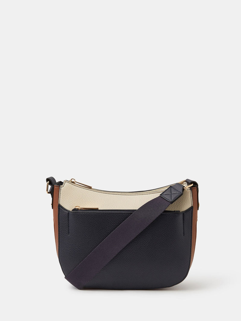 Accessorize navy cross-body bag in faux leather with wide strap, UK version