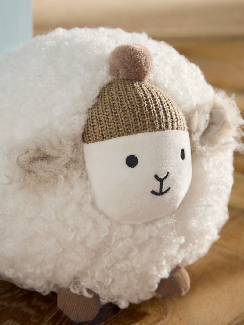 Natural sheep doorstop with knitted bobble hat and rustic tones - British product