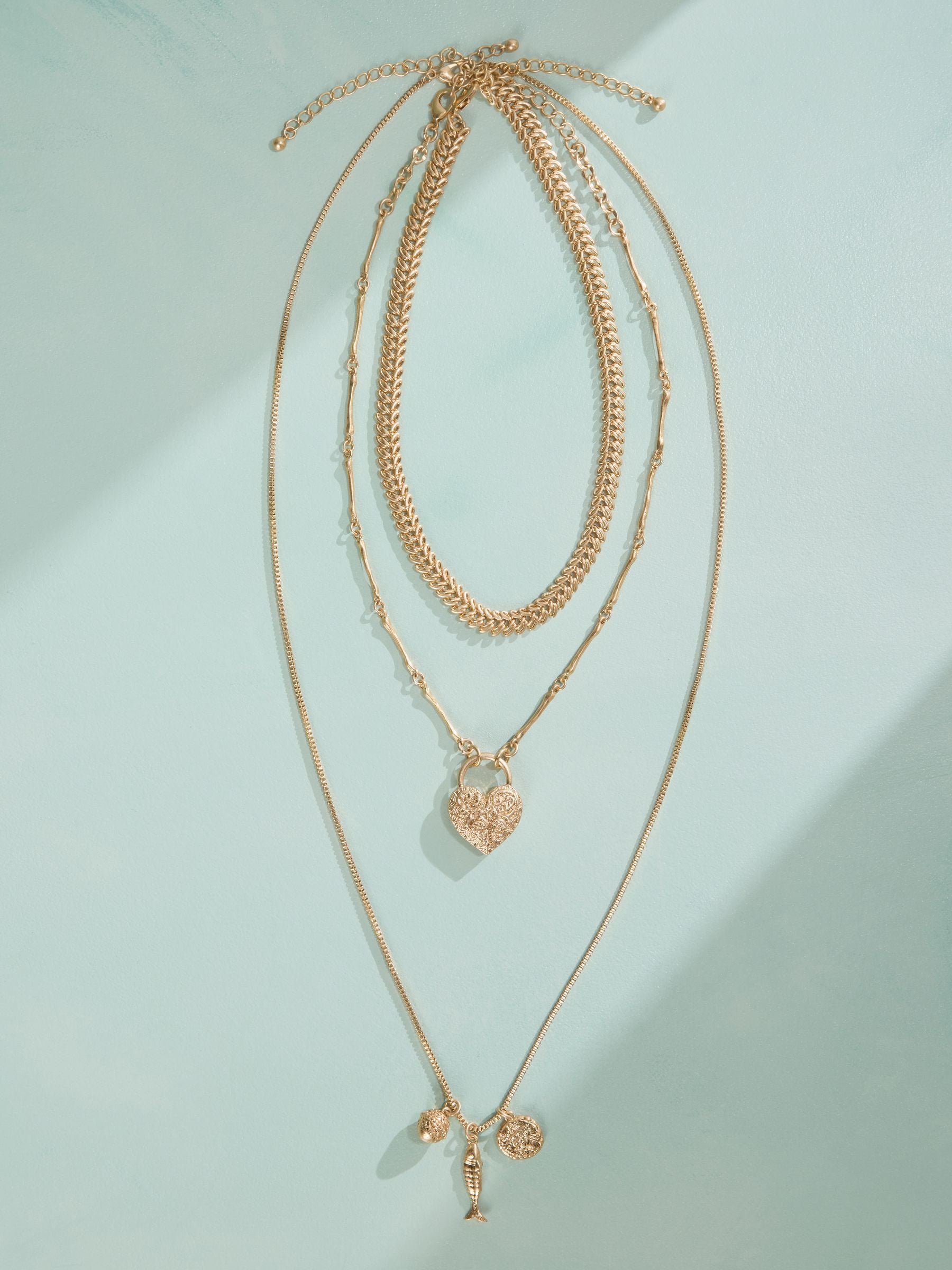 Tabitha Simmons gold tone layered charm necklace, imported from the UK
