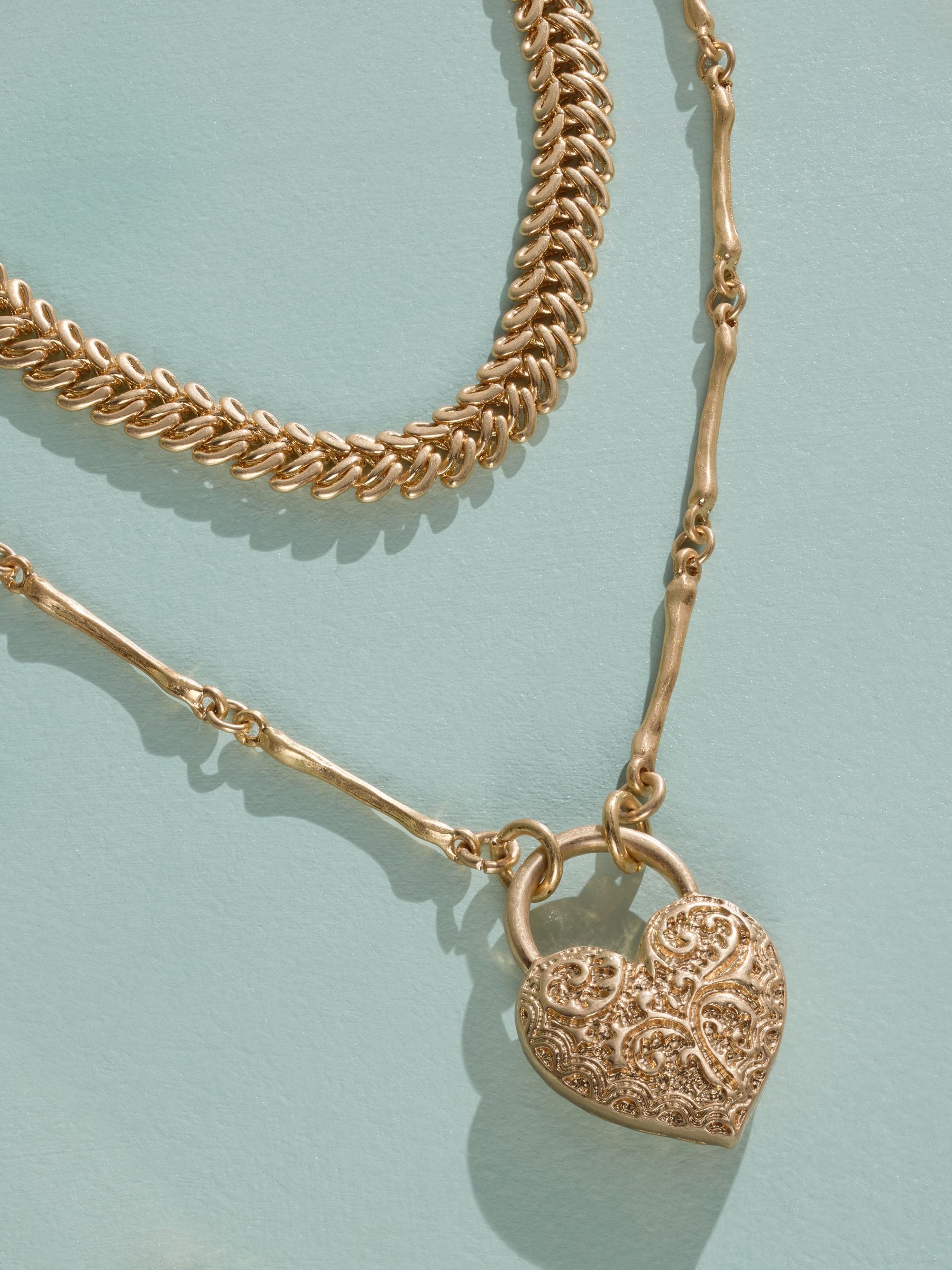 Tabitha Simmons gold tone layered charm necklace, imported from the UK
