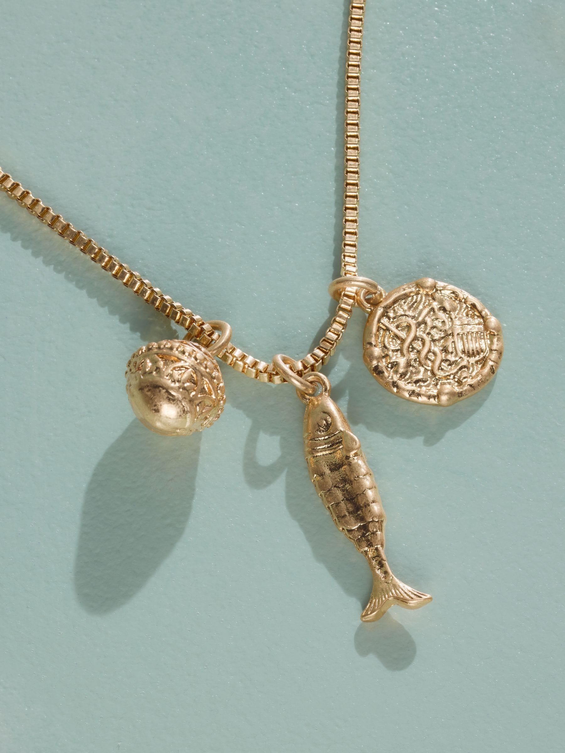 Tabitha Simmons gold tone layered charm necklace, imported from the UK
