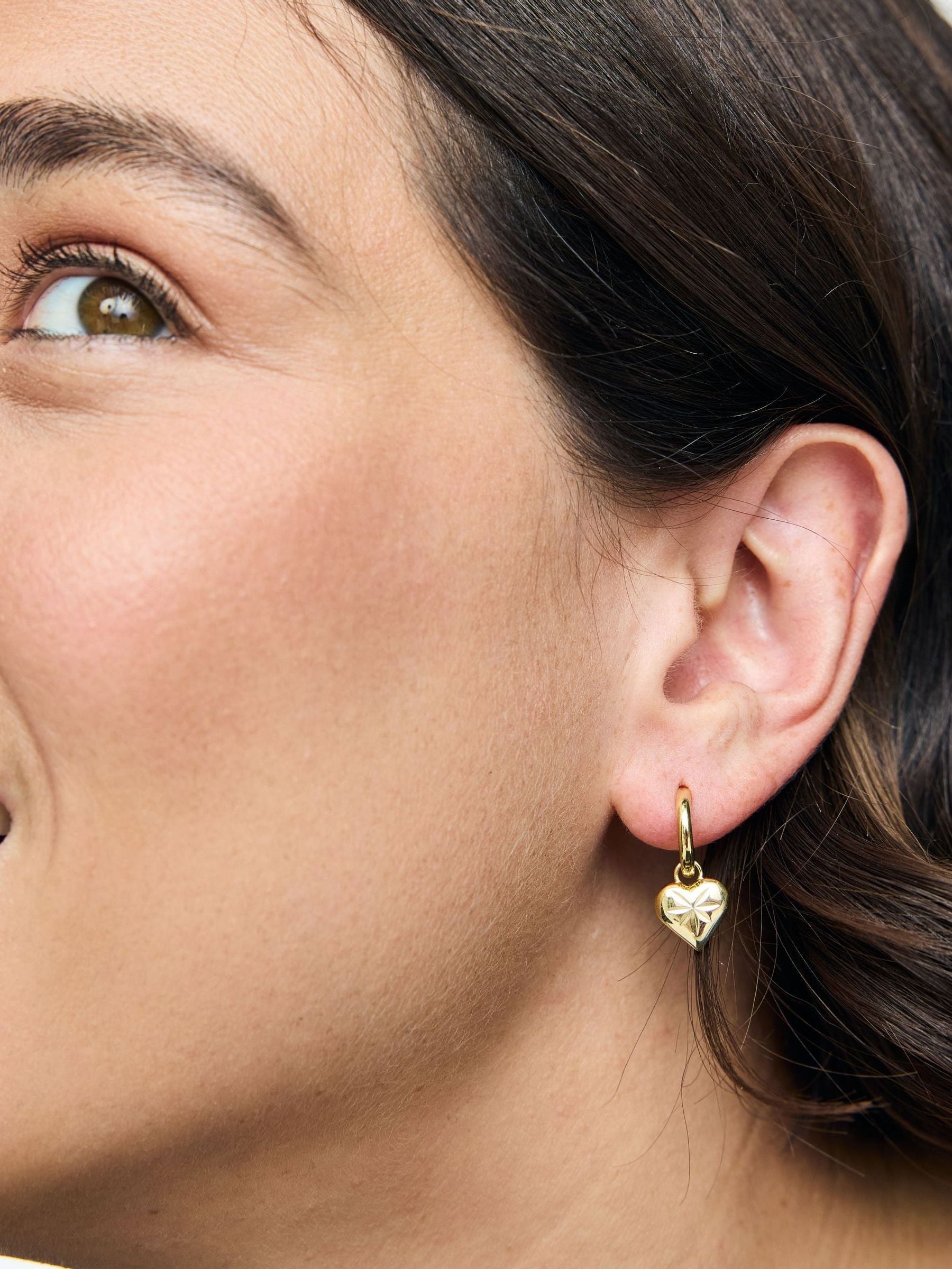 Oliver Bonas Cora engraved heart charm hoop drop earrings, UK version