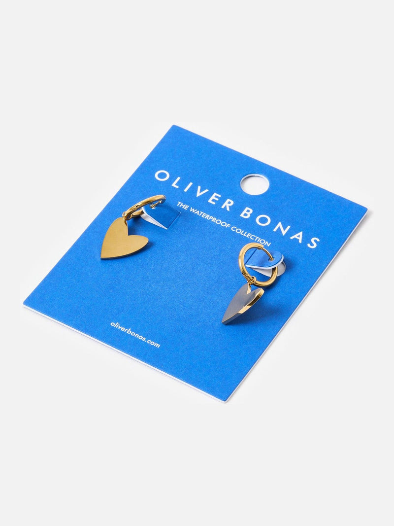 Oliver Bonas gold tone heart huggie earrings, imported from the UK