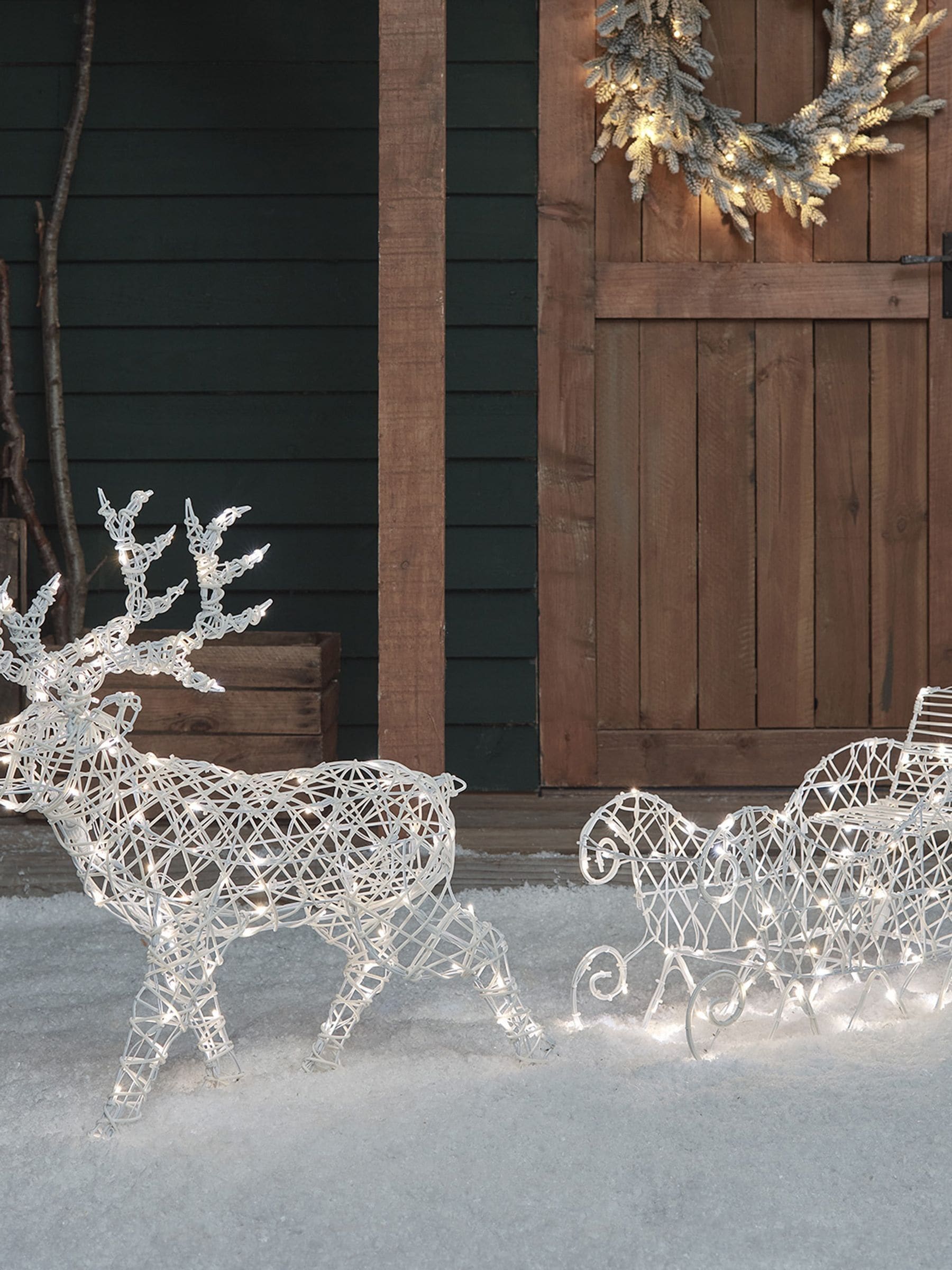 Lights4fun white rattan reindeer sleigh 70cm, imported from the UK