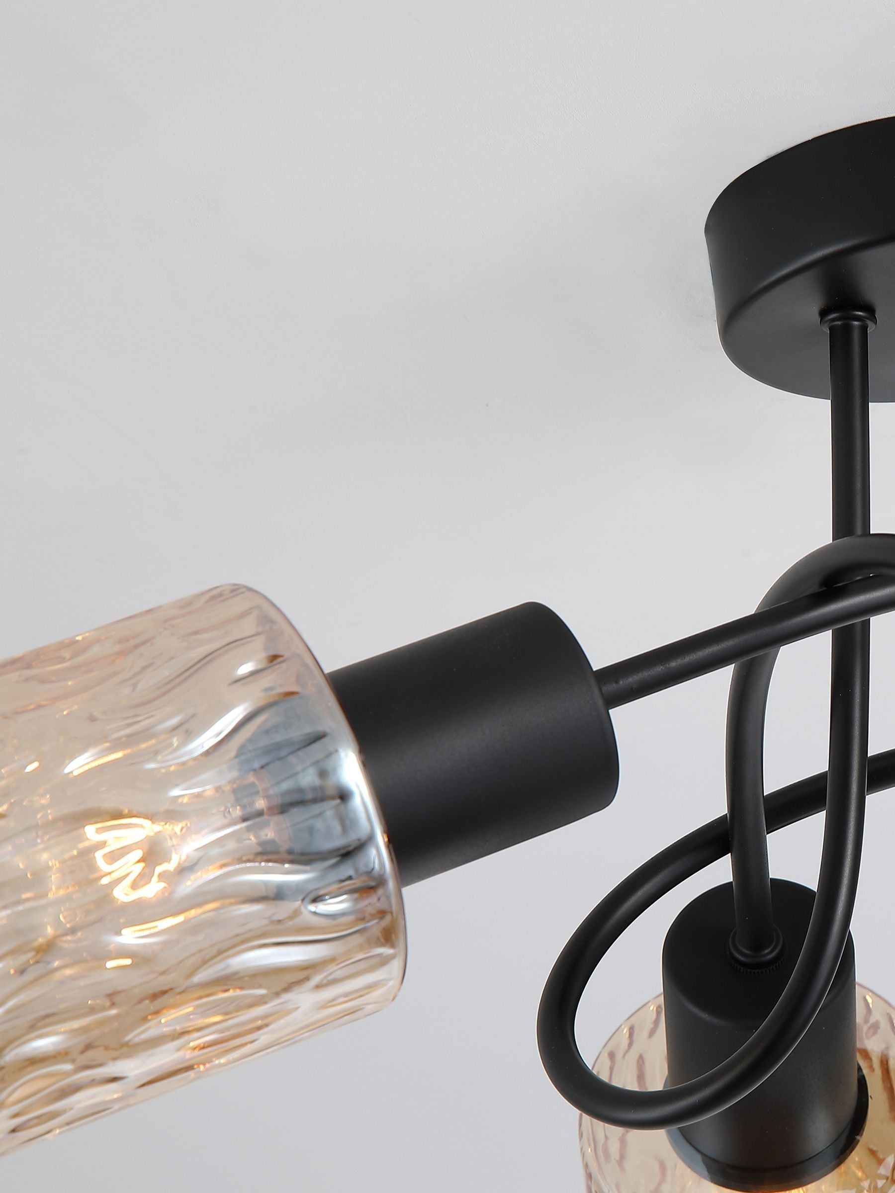 Searchlight amber and black three-light ceiling lamp, imported from the UK