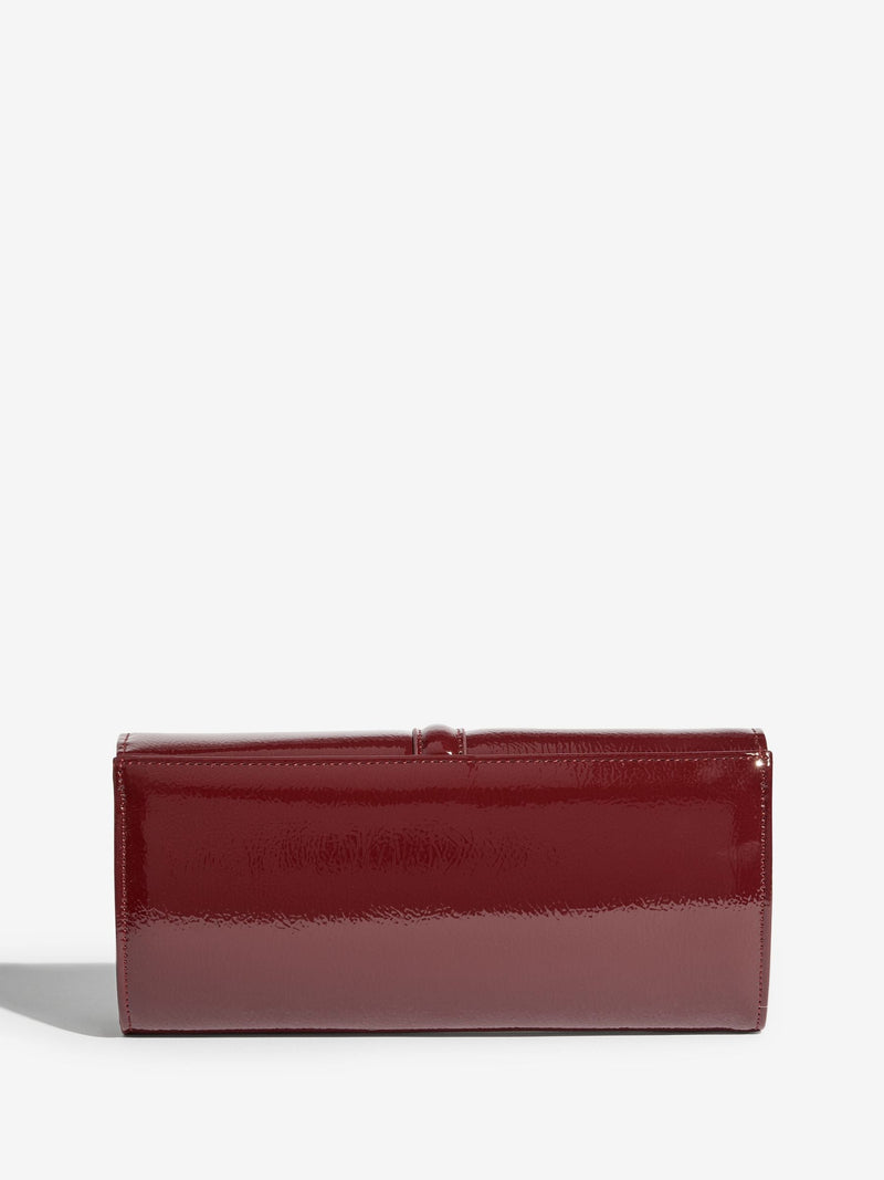 Lipsy burgundy red tassel trim clutch bag, UK version
