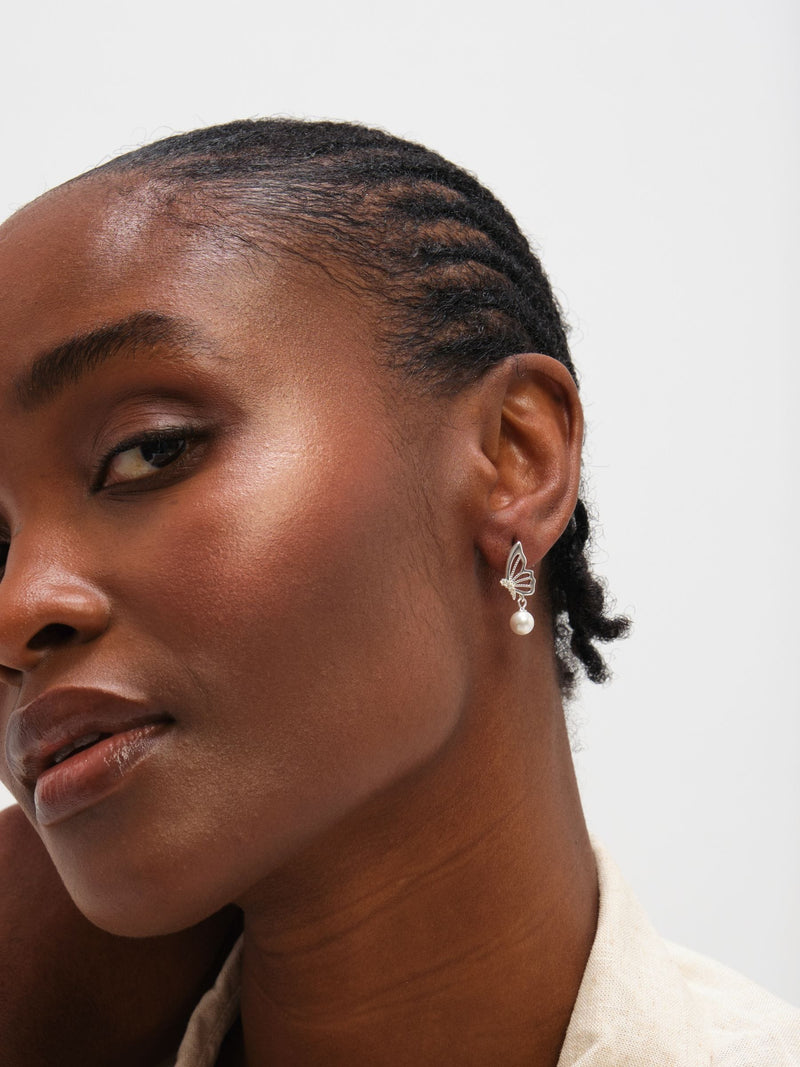 Inicio polished butterfly pearl drop earrings (British brand)