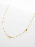 Ted Baker Iona Mini Icons necklace gold tone, imported from the UK