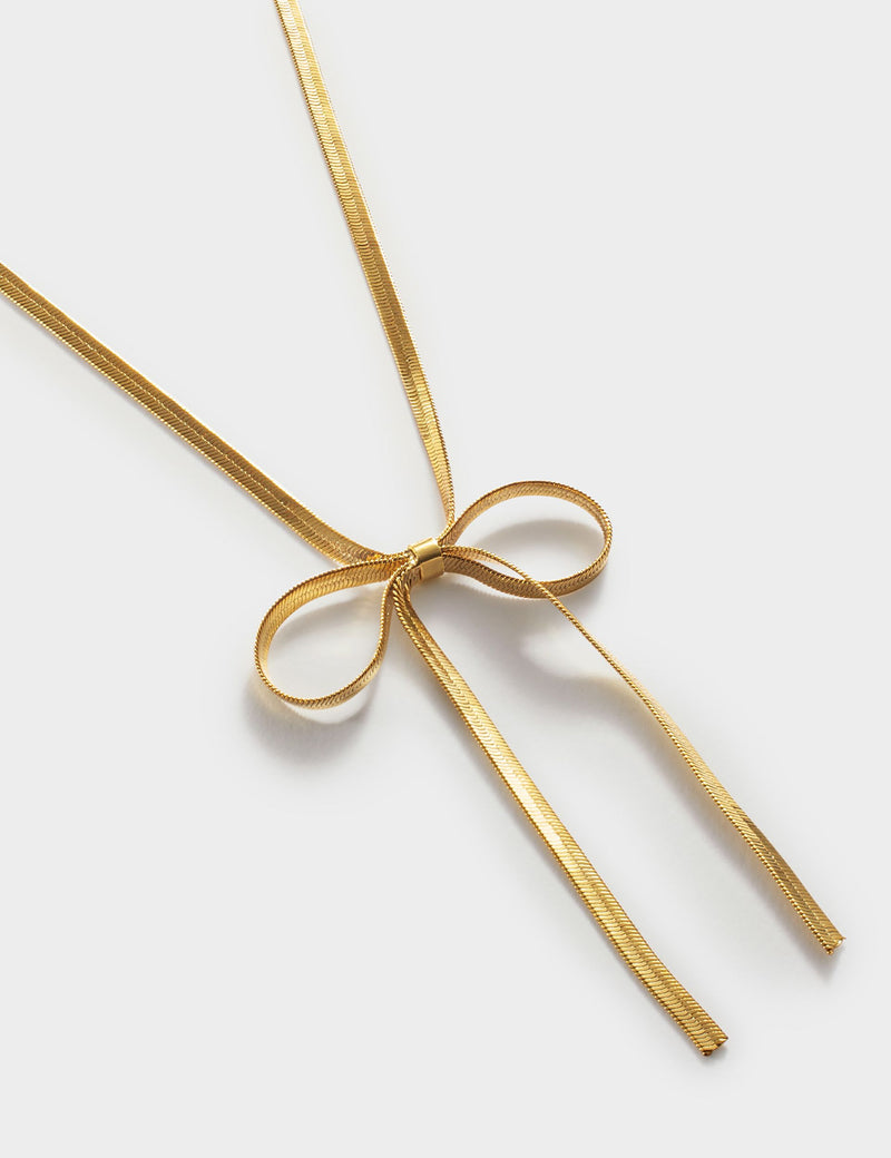 Katie Loxton gold coated ribbon bow necklace, UK version