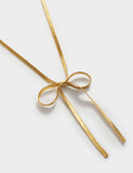 Katie Loxton gold coated ribbon bow necklace, UK version
