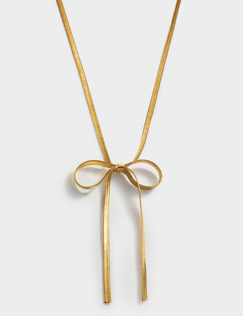 Katie Loxton gold coated ribbon bow necklace, UK version
